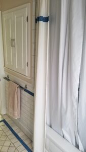 Medicine cabinet and combined shower/tub