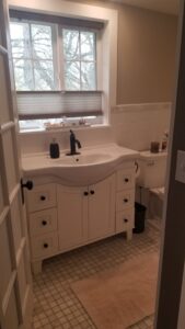Downstairs bathroom with view of backyard