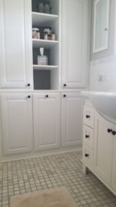 Built-in hamper and storage in bathroom