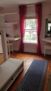 Second bedroom with original wood flooring