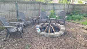 Backyard firepit with chairs for roasting s’mores