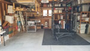 Two-car garage with shelving and attic storage
