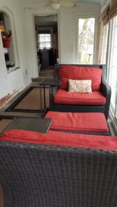 Four-season front porch with morning coffee setup